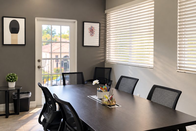 Meeting table and chairs at WCR’s Miami Lakes facility